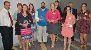 Free Agents Marketing staff and other winners display their awards from the Hampton Roads Chapter of the PRSA.