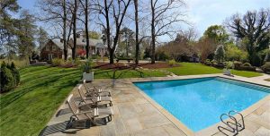 The 5-acre Summit property includes a pool and tennis court.