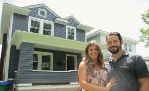 Breese and Josh Romano of Cobblestone Development, in front of 2723 Edgewood Ave., one of the 40-plus homes they're on track to remodel by the end of this year.