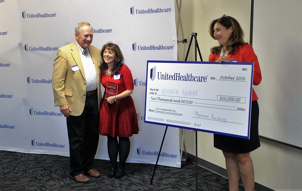 Lee and Veronica Nugent (left) are presented a $10,000 check by UnitedHealthcare's Marianne Mandazzo Wednesday afternoon during its first ever community awards pitch competition at Chesterfield's BizWorks. (J. Elias O'Neal)
