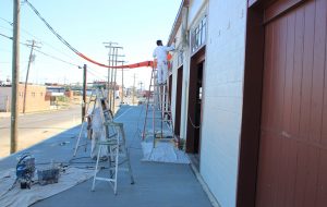 Crews continue work on Vasen's patio fronting West Moore Street in Scott's Addition. (J. Elias O'Neal) 