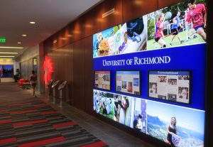 The center's main hallway includes a touchscreen video wall.