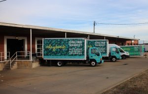 Relay Foods trucks await deliveries at the Scott's Addition distribution warehouse.