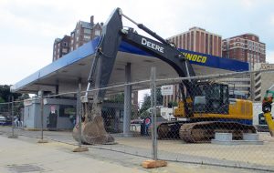 Work is underway to tear down Uphoff’s Sunoco gas station at the corner of North Belvidere and West Grace streets. (Jonathan Spiers)