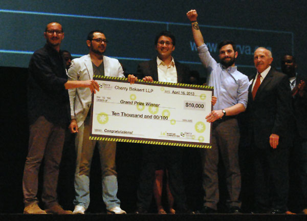 Speakeasy co-founders Jon Davidow, Jacques Fuentes, Rob Forrest and Joey Figaro accept a check for $10,000. (Photo by Lena Price)