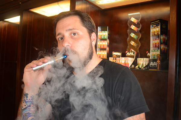 Avail Vapor co-founder Donovan Phillips demonstrates his product. (Photos by Mark Robinson)