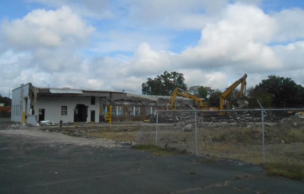 An old building being cleared for the 103-unit apartment project. (photo by Burl Rolett)