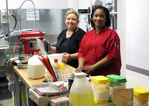 Sweet Creations owner Sana Aziz, right, with assistant manager Brandi Palmore. (By Michael Thompson)