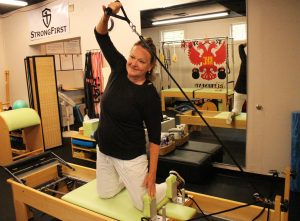 Parrish combines Pilates with other stretching and resistance equipment.