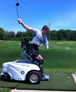 A golfer takes a swing with help from 