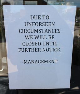 A sign posted on the door announces Family Meal's closure. (J. Elias O'Neal)