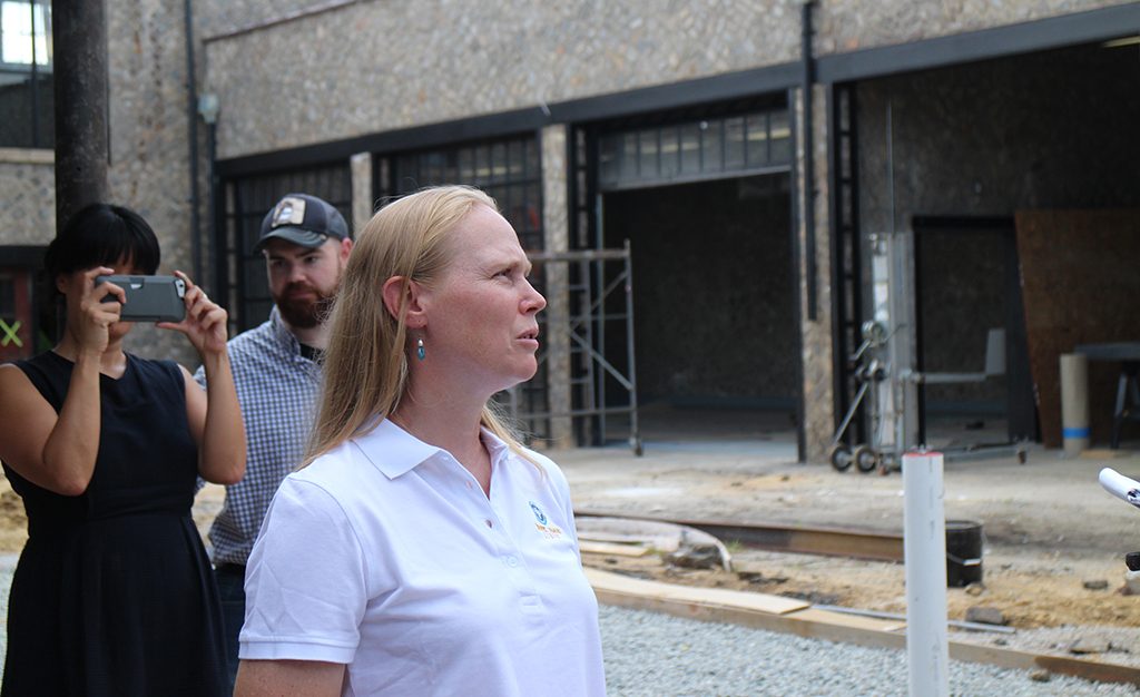 Blue Bee owner Courtney Anderson Mailey surveys the construction. (Michael Schwartz)