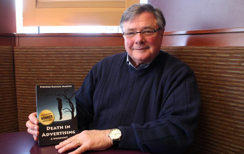 Stephen Martin with his book, "Death in Advertising." (Jonathan Spiers)