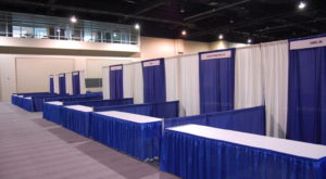 12.21R Exhibits Booths Blue White w Sign Table2 1536x1021 1