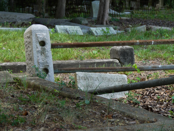 Evergreen Cemetery broken fence