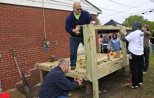 Rebuilding Together volunteers work on home renovations. Photos courtesy of Rebuilding Together.