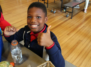 Third-grader Qadir Faulk at lunch. The school gives students two meals and a snack for free each day.