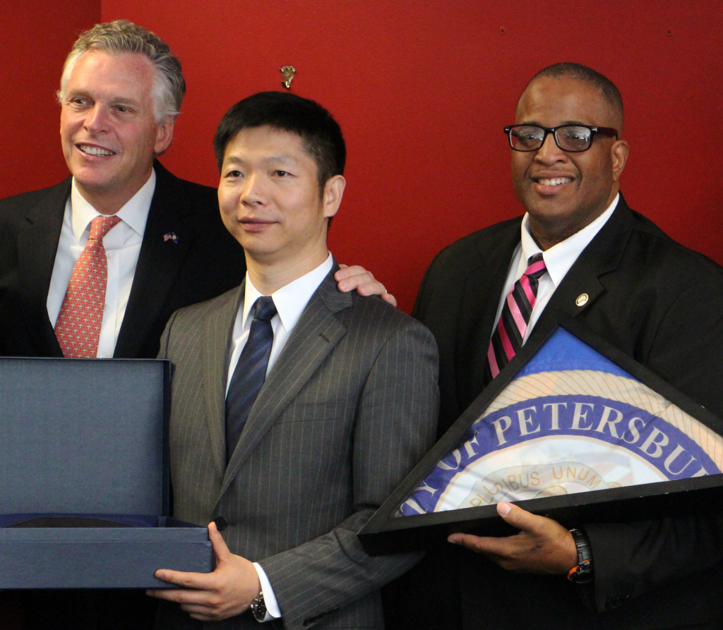 From left: Gov. Terry McAuliffe, Tao Ye and Petersburg Mayor Brian Moore. 